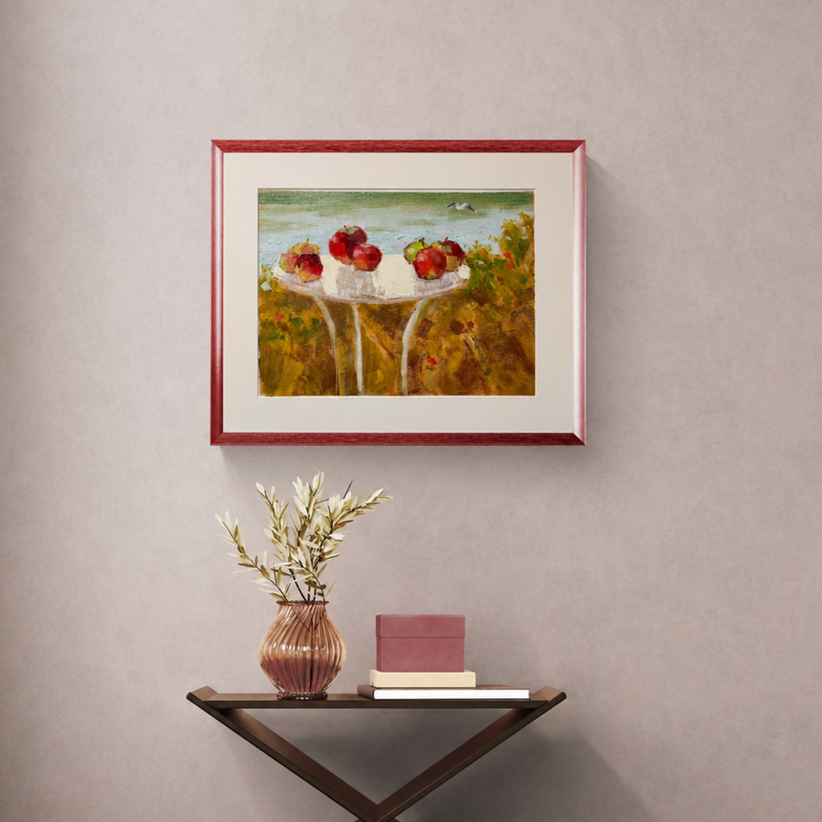 Seaside Still Life by VIKTĖ, framed in red, hanging above a console table in a hallway